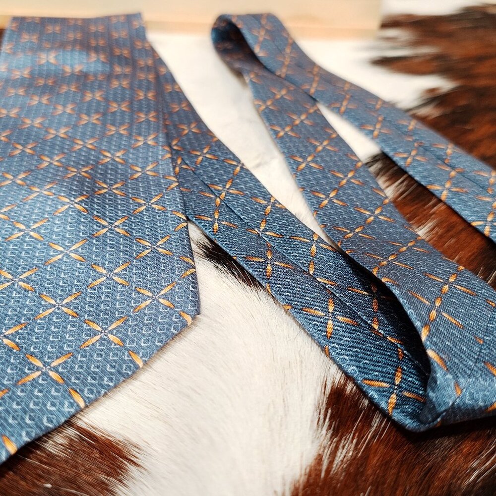 Nautica Blue, White & Orange 4-Petal Orange on a blue square background Silk Tie